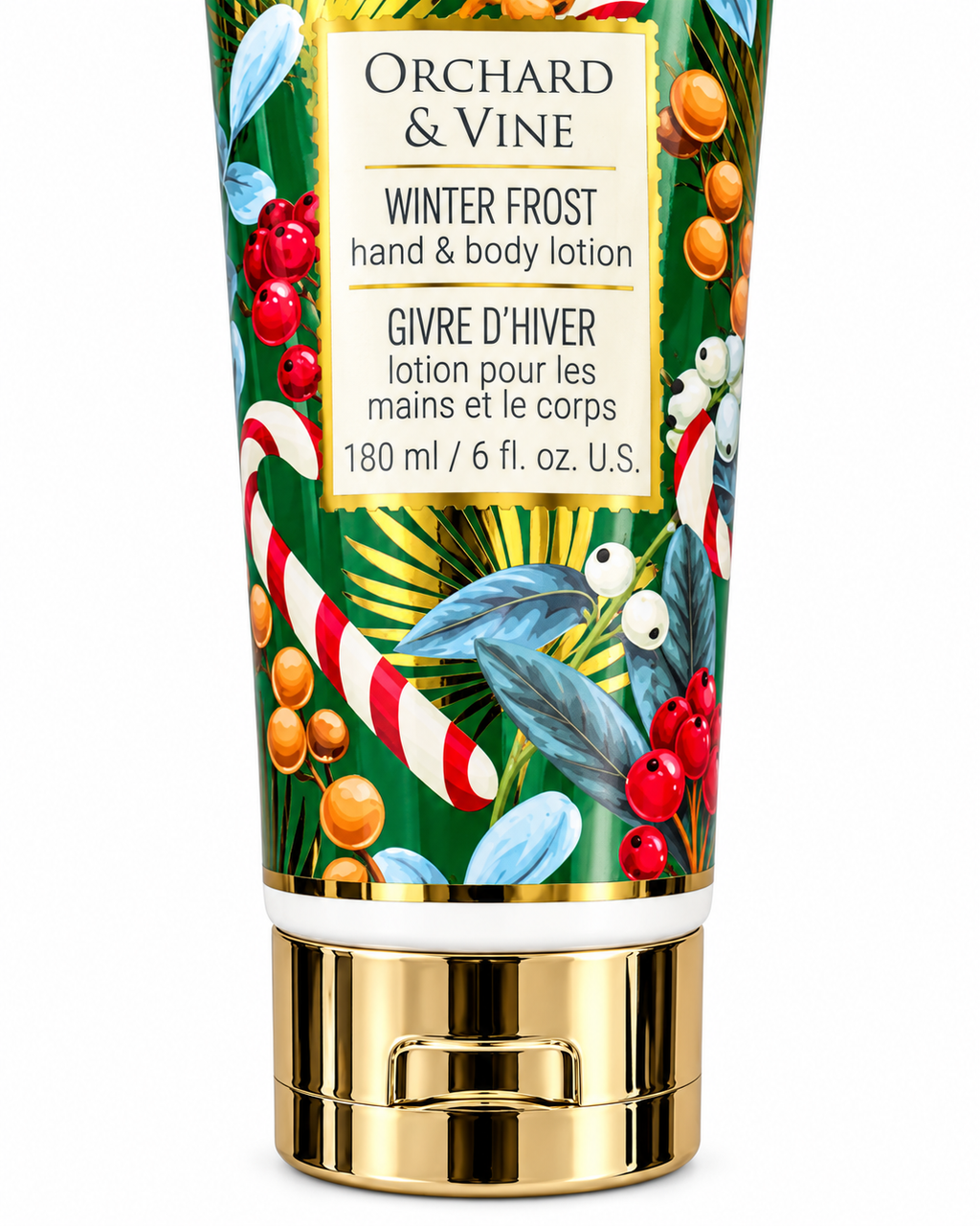 Close-up of the Winter Frost hand and body lotion label showing 180 mL and 6 fl oz, holiday illustrations, and the gold-tone cap
