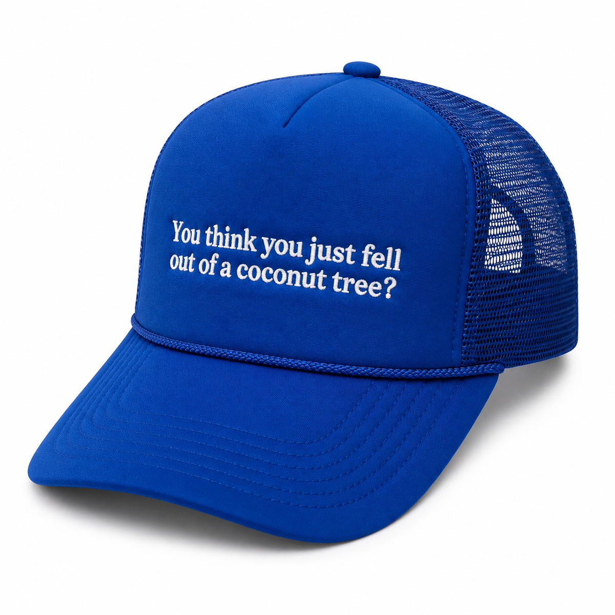 Three-quarter view of Coconut Tree Trucker Hat showing royal blue foam front with white embroidered quote, rope accent, and blue mesh back, on a white background.
