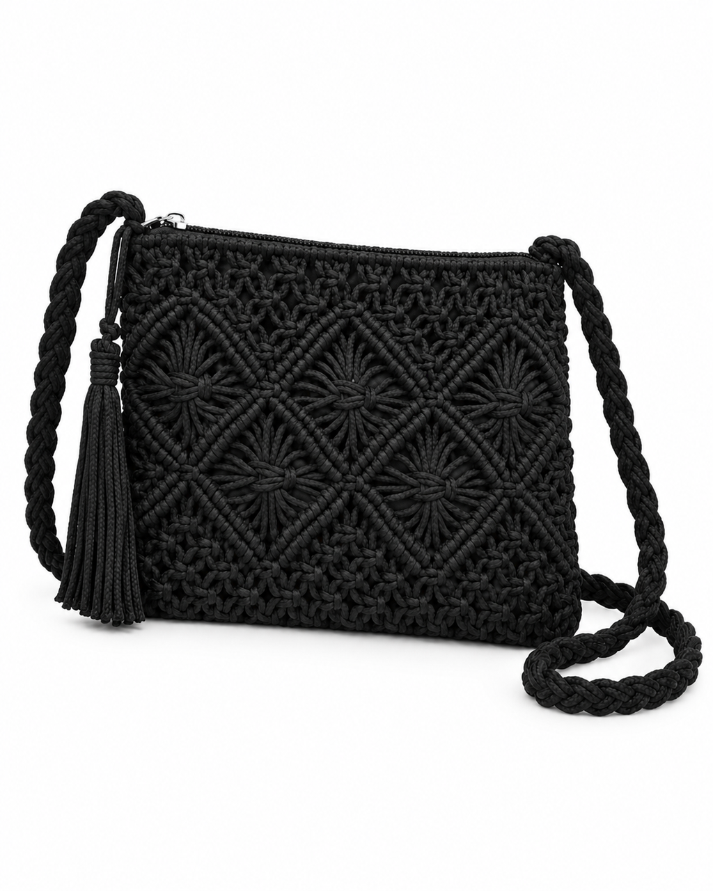 Black Woven Bohemian Tassel Crochet Shoulder Bag three-quarter angle view showing macrame cord diamond lattice pattern, slight structured depth, full silver top zipper run, braided black cord shoulder strap with black suede tassel hanging from strap attachment knot on white background
