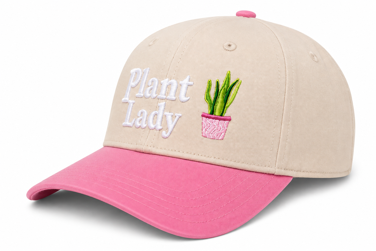 Side view of Plant Lady Baseball Cap showing cream structured crown, pink brim, and solid back, on a white background.

