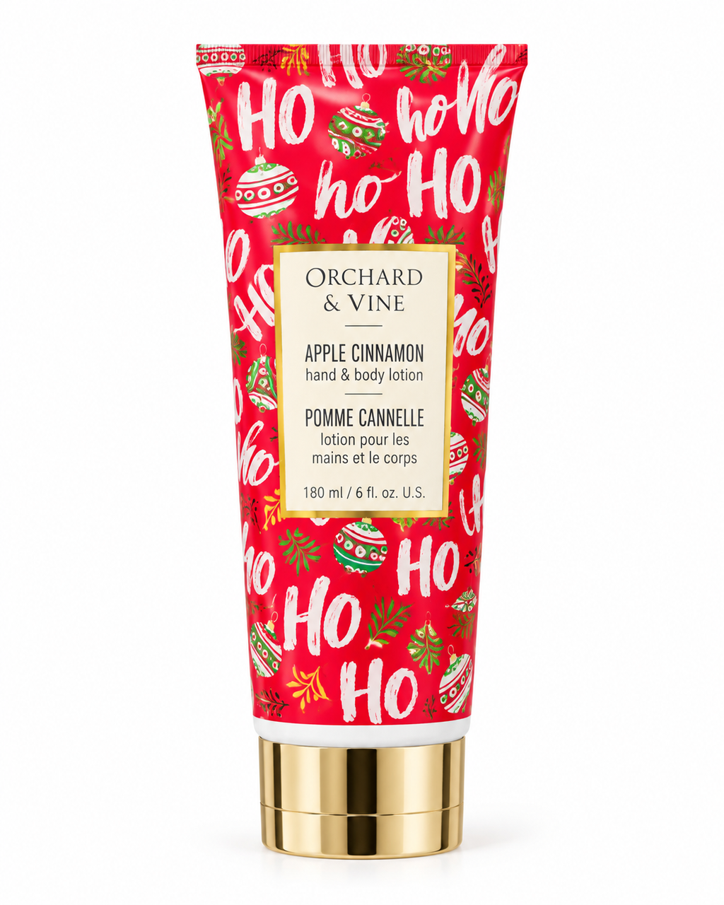 Front view of Orchard & Vine Apple Cinnamon hand and body lotion showing red HO HO HO packaging, Christmas ornaments, and the 6 fl oz label

