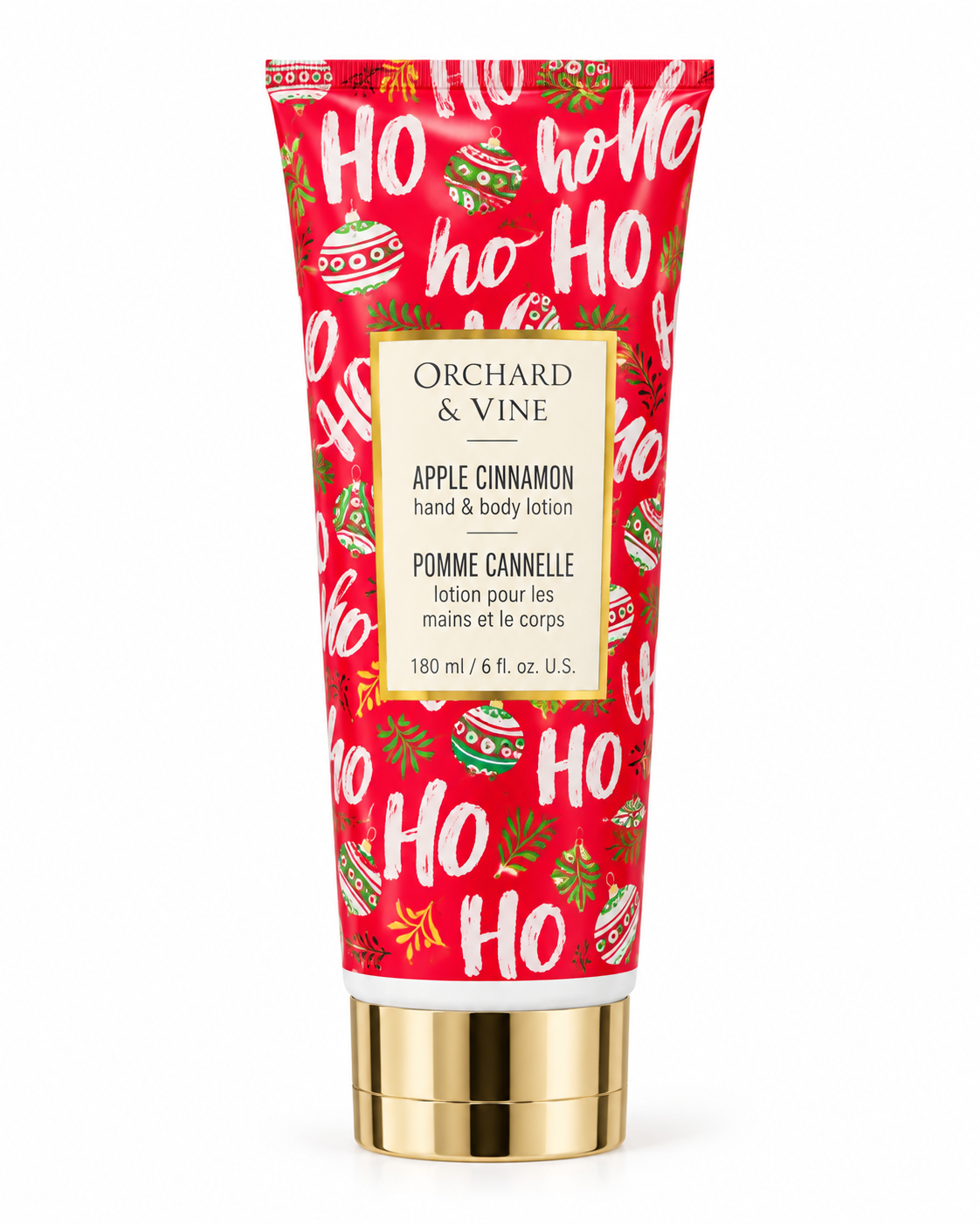 Front view of Orchard & Vine Apple Cinnamon hand and body lotion showing red HO HO HO packaging, Christmas ornaments, and the 6 fl oz label
