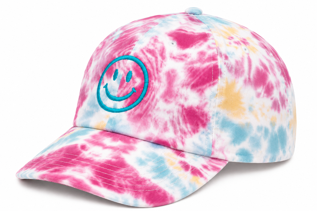 Side view of Tie-Dye Smiley Face Cap in pink, blue, and yellow tie-dye with solid back, shown on a white background.

