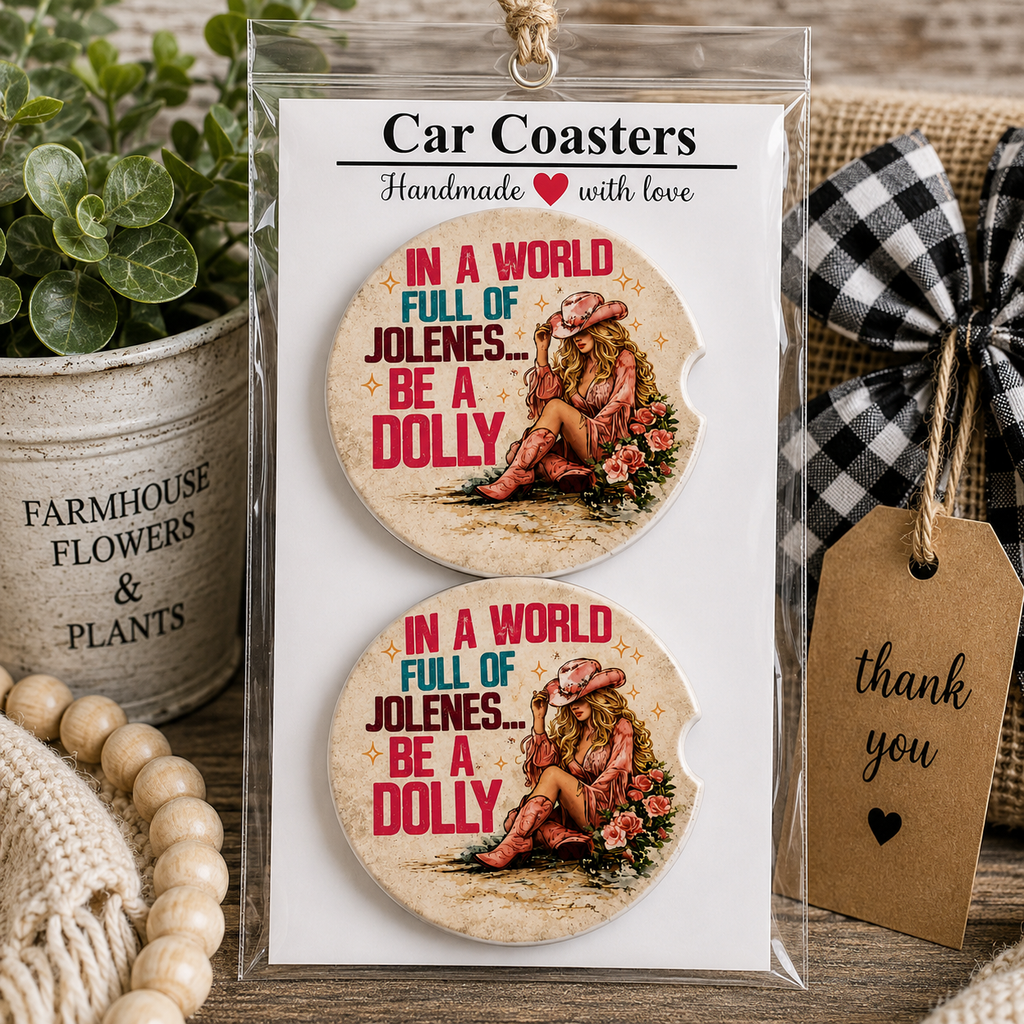 In a World Full of Jolenes Be a Dolly Car Coaster Set in handmade packaging — gift-ready ceramic coasters with retro cowgirl in pink hat, roses, and bold pink and teal lettering, set of 2
