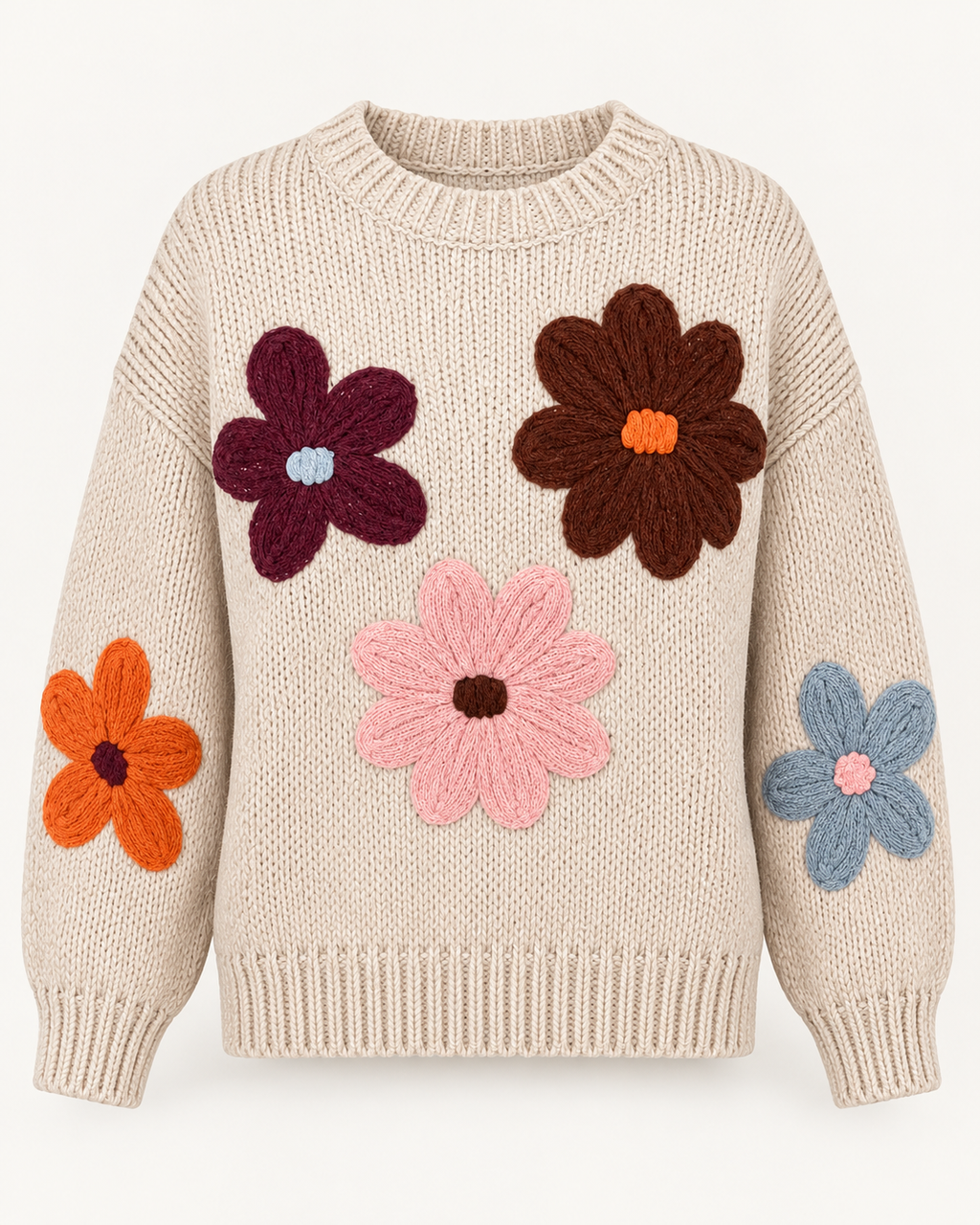 Front view of the tan knit sweater showing burgundy, brown, pink, orange, and dusty blue flowers with a ribbed crewneck, cuffs, and hem
