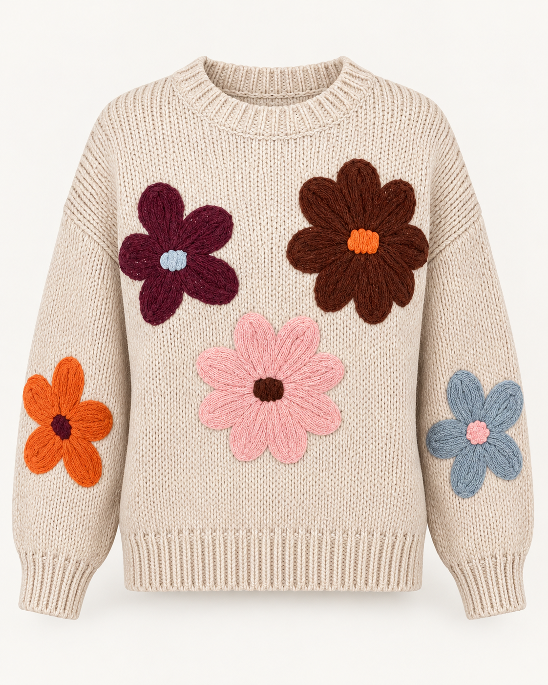 Front view of the tan knit sweater showing burgundy, brown, pink, orange, and dusty blue flowers with a ribbed crewneck, cuffs, and hem
