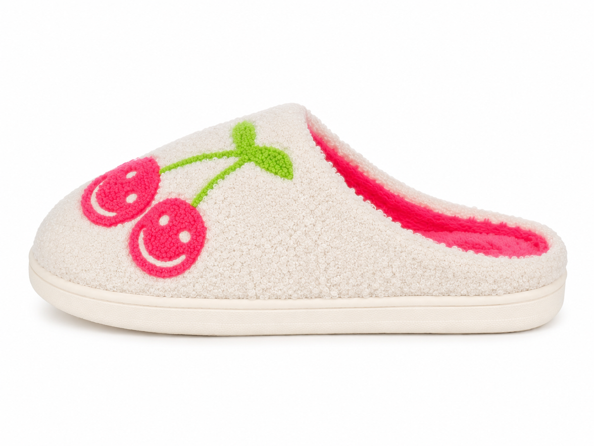 White cozy slipper with pink smiley cherry embroidery and green stem, side view
