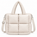 Sand Mini Quilted Puffer Tote front view with soft sand neutral puffer body, six large padded square panels, padded rounded top handles, adjustable shoulder strap, and silver hardware on white background
