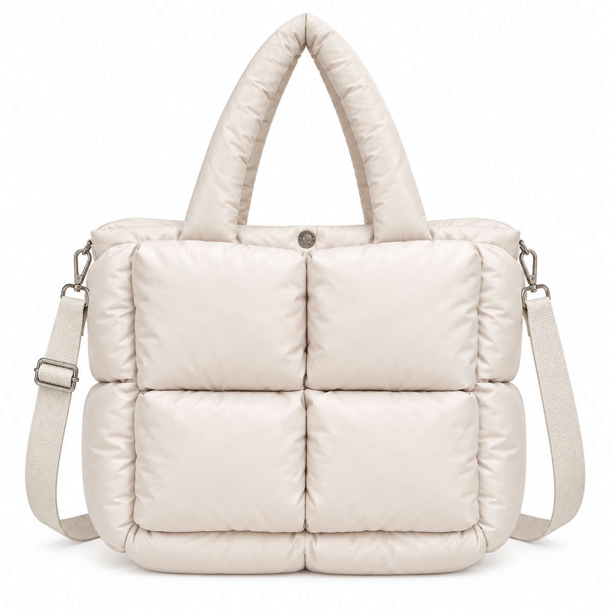 Sand Mini Quilted Puffer Tote front view with soft sand neutral puffer body, six large padded square panels, padded rounded top handles, adjustable shoulder strap, and silver hardware on white background
