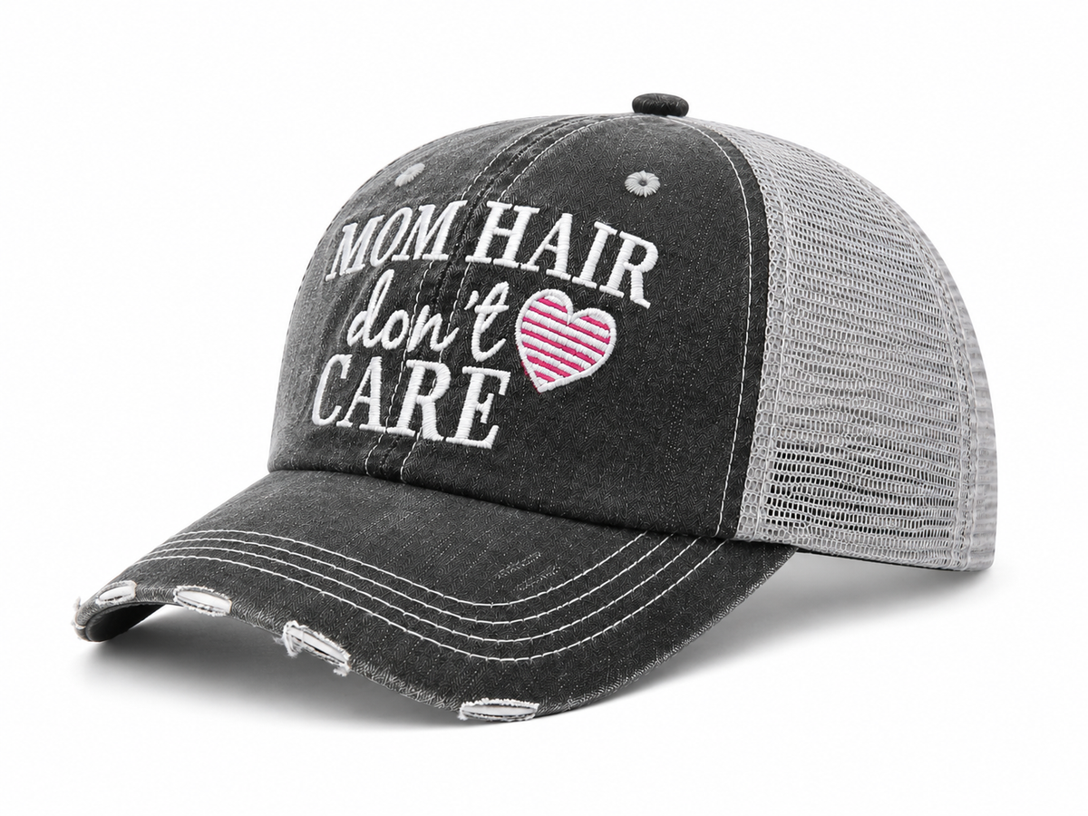Mom Hair Don't Care Trucker Hat side angle view showing distressed charcoal front and gray mesh back
