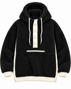 Front view of the black sherpa pullover hoodie showing ivory snap placket, white drawstrings, front zippered pocket, hand pockets, cuffs, and hem
