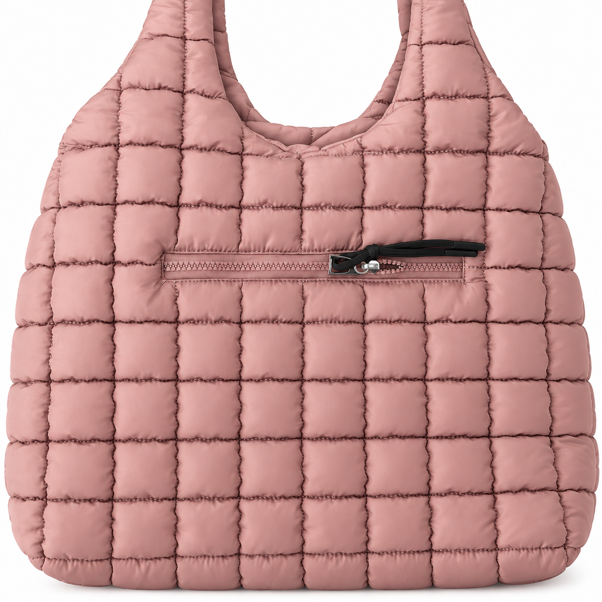 Close-up of Mauve Quilted Tote Bag showing soft mauve puffer quilted square panels and front exterior zippered pocket with black zipper pull and tassel detail
