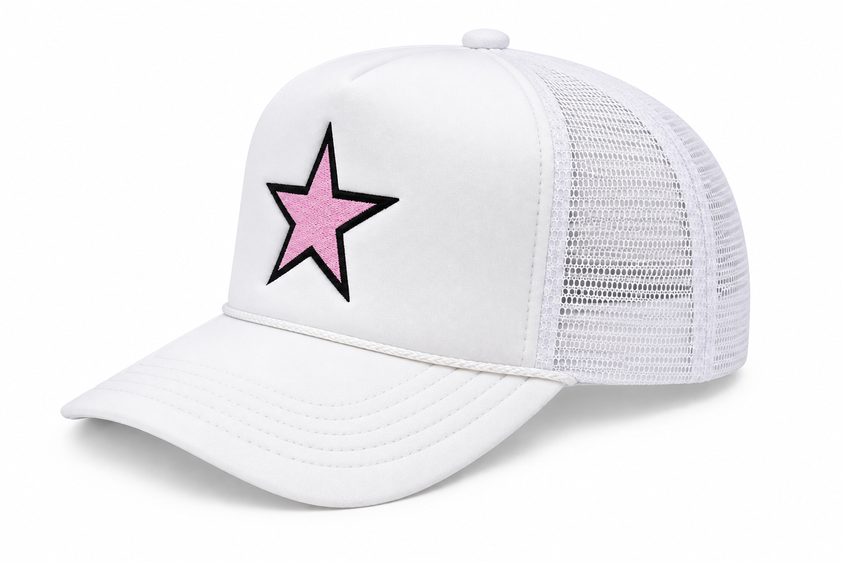 Pink Star Trucker Hat three-quarter angle view showing white structured front, white mesh back, and pink embroidered star with bold black outline on white background

