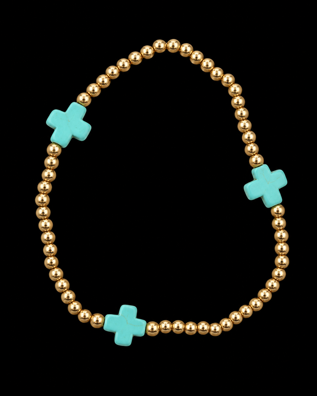 Gold ball bead stretch bracelet with three evenly spaced turquoise cross accents displayed flat in a circle on black background

