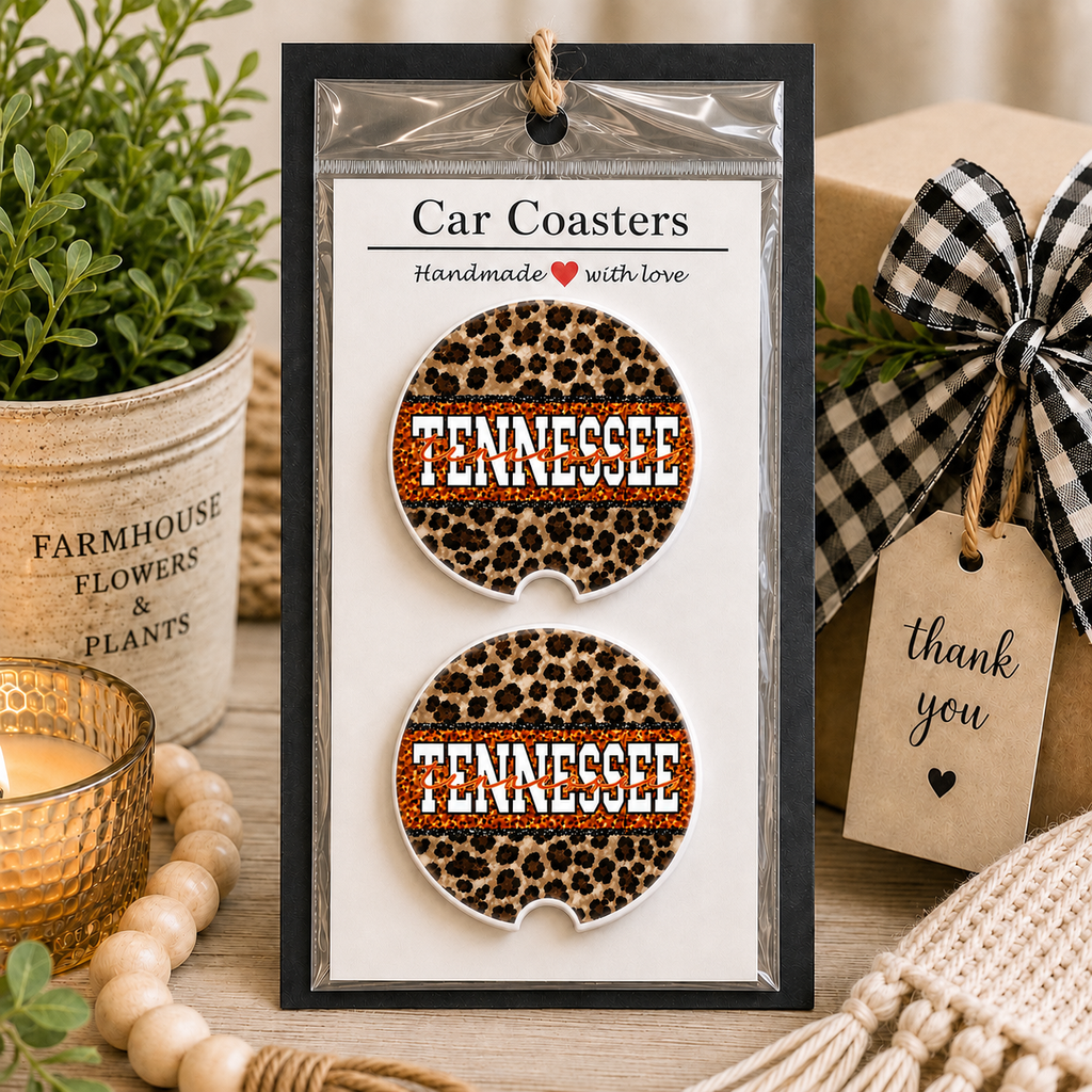 Tennessee Leopard Car Coaster Set in handmade packaging — gift-ready ceramic coasters with leopard print and orange Tennessee lettering, displayed with gift box and greenery, set of 2

