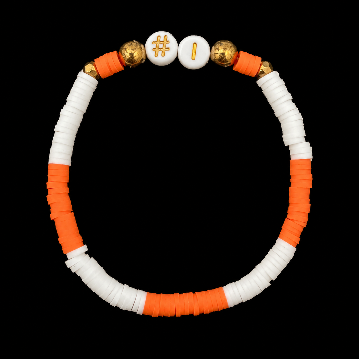 Orange and white heishi disc bead stretch bracelet with white #1 letter beads and gold-tone accent balls on black background
