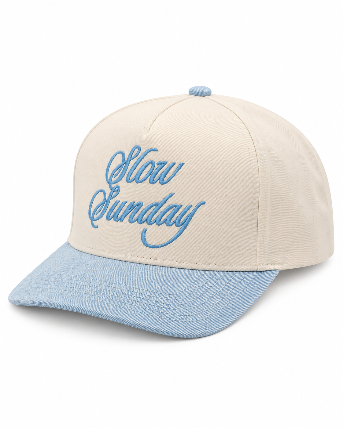 Slow Sunday Baseball Cap three-quarter angle view showing cream structured crown, light blue bill, and light blue embroidered Slow Sunday script on white background
