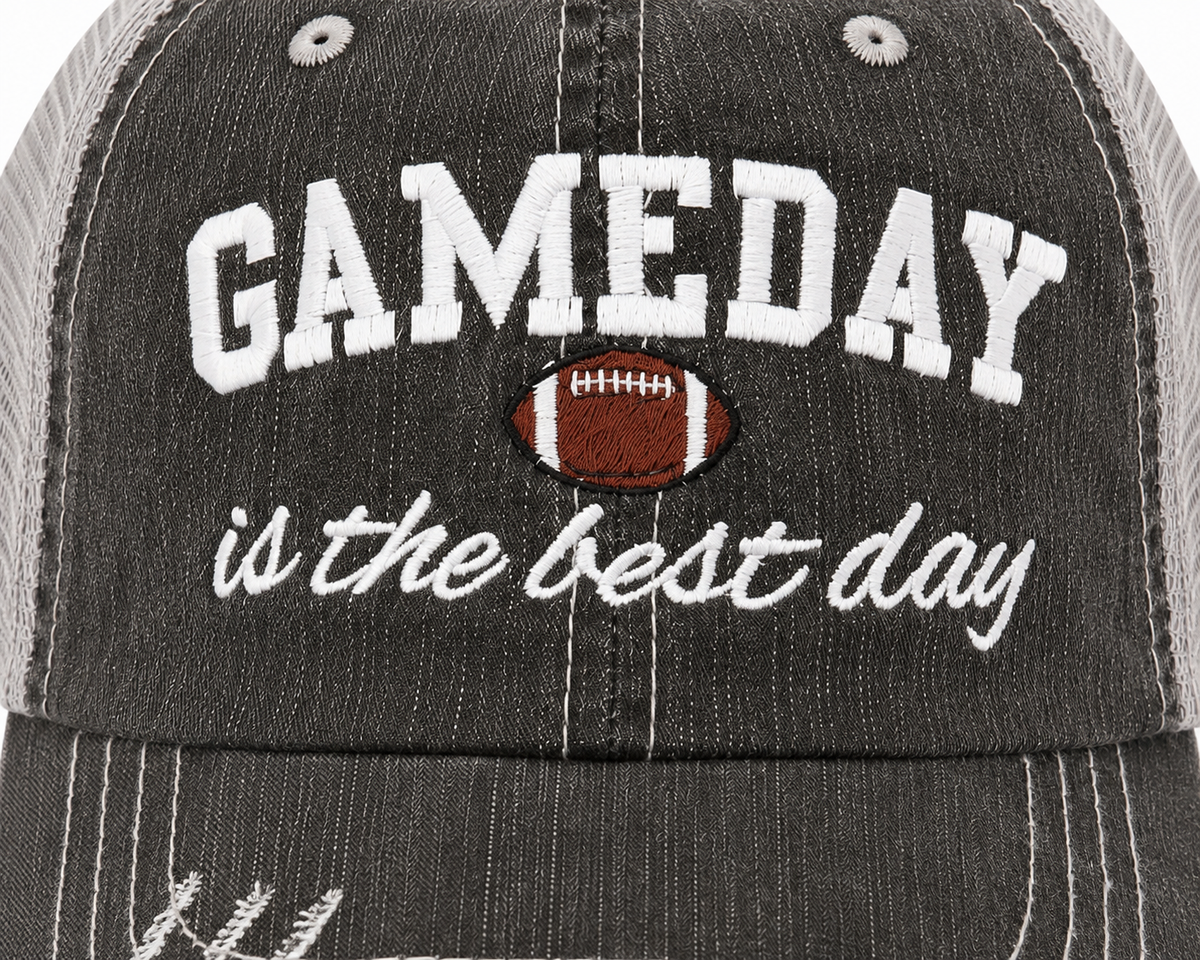 Close-up of GAMEDAY is the best day embroidery with football detail on distressed charcoal trucker hat
