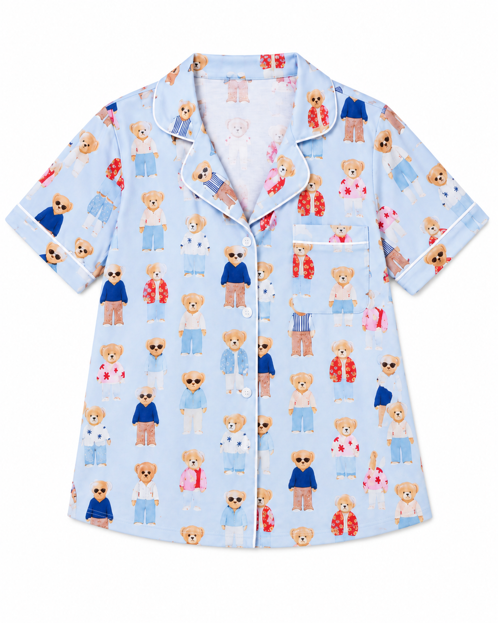 Teddy Bear Pajama Short Set top flat lay showing light blue short-sleeve button-front top with notched collar, all-over illustrated fashion teddy bear print in blue, red, and pink outfits, white piping on collar and cuffs, and white-piped chest pocket on white background
