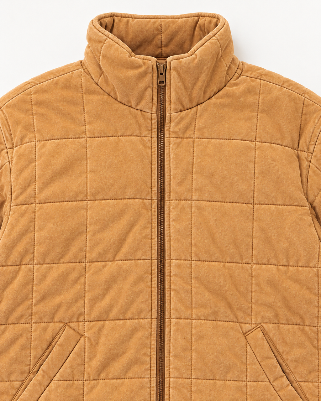 Close-up of Camel Garment Washed Quilted Jacket showing stand-up collar, bronze zipper pull, camel washed quilted grid stitching, and front slit pocket openings with welt trim on white background
