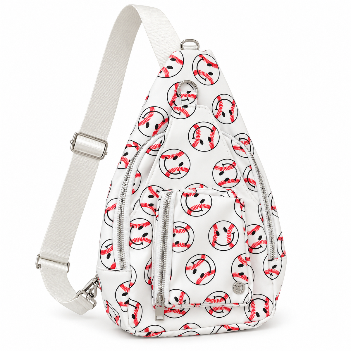 Baseball Smiley Sling Bag opposite three-quarter angle view showing white all-over baseball smiley face print, two large front silver zipper compartments, triangular sling shape, and wide flat cream adjustable strap with silver hardware on white background
