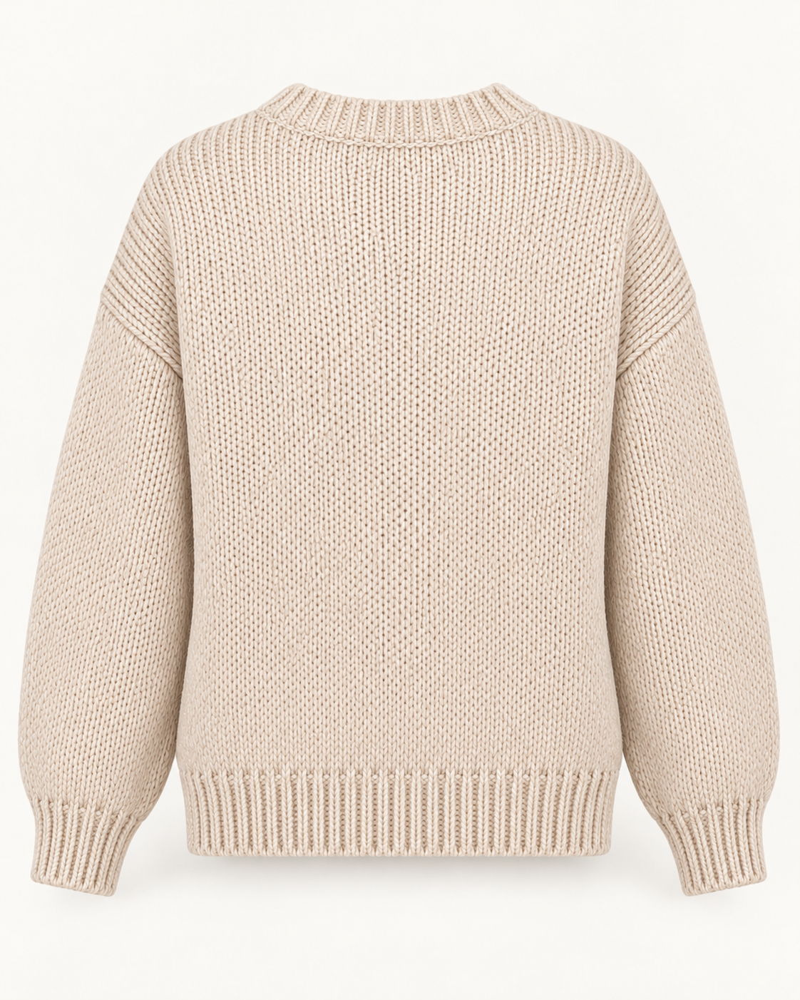 Back view of the tan knit sweater showing the plain back, dropped shoulders, long sleeves, and ribbed neckline, cuffs, and hem
