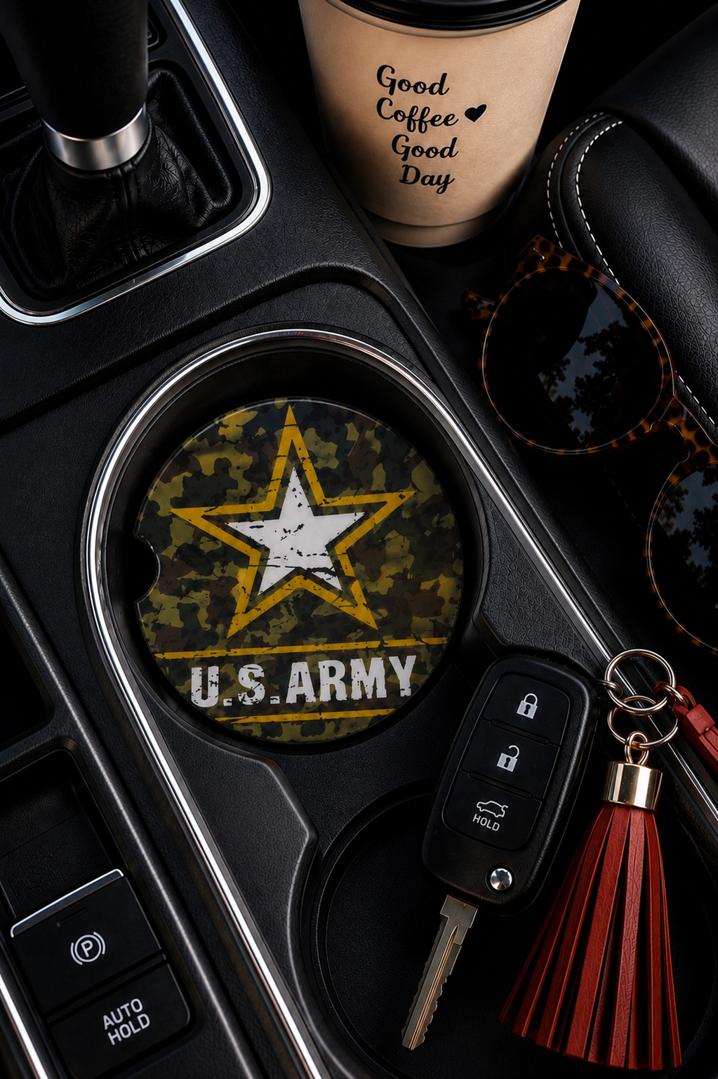 United States Army ceramic car coaster in cup holder — U.S. Army gold star emblem on camouflage background, shown in car console with coffee cup and sunglasses

