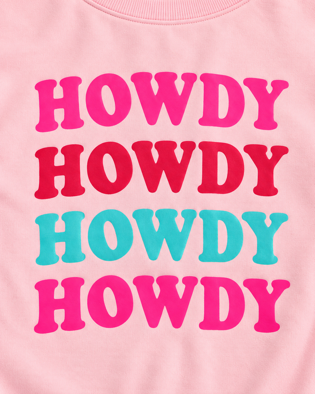 Close-up of four stacked HOWDY rows in bright pink, red, turquoise, and bright pink on the light pink sweatshirt
