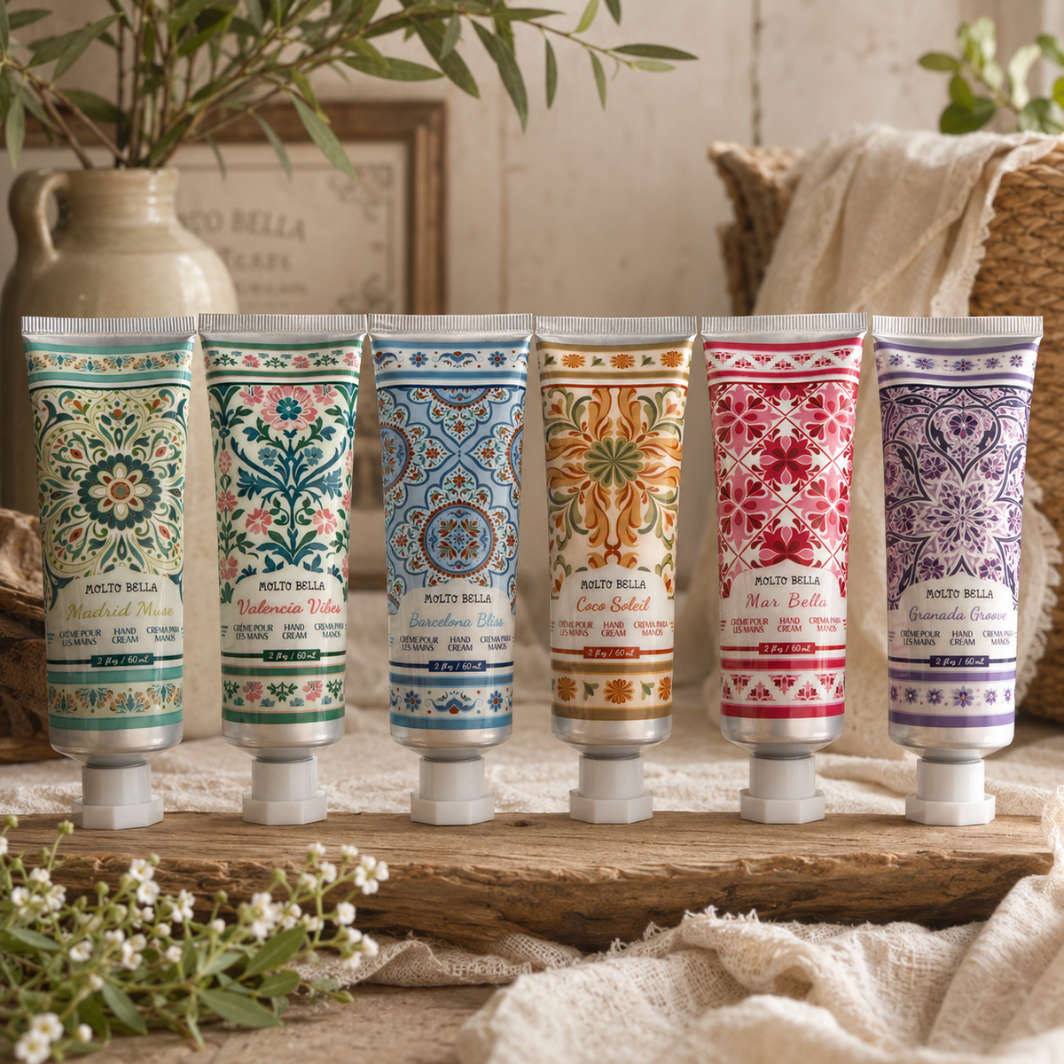 Molto Bella hand cream collection featuring all six 2 oz scents displayed together in a warm boutique lifestyle setting with greenery and neutral farmhouse decor.