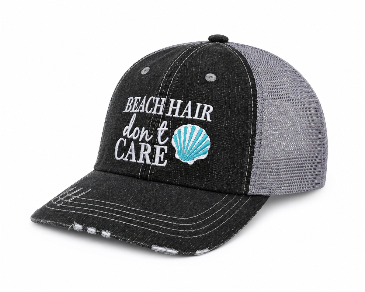Side view of Beach Hair Don't Care trucker hat in distressed black with gray mesh back and white embroidered lettering, shown on a white background.
