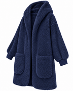 Angled front view of the navy hooded sherpa cardigan showing its relaxed drape and long sleeves
