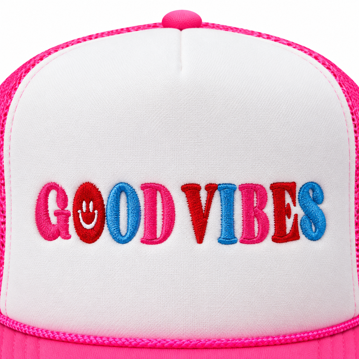 Close-up of multicolor embroidered Good Vibes lettering in pink, red, and blue with white smiley face detail on white structured trucker hat front panel
