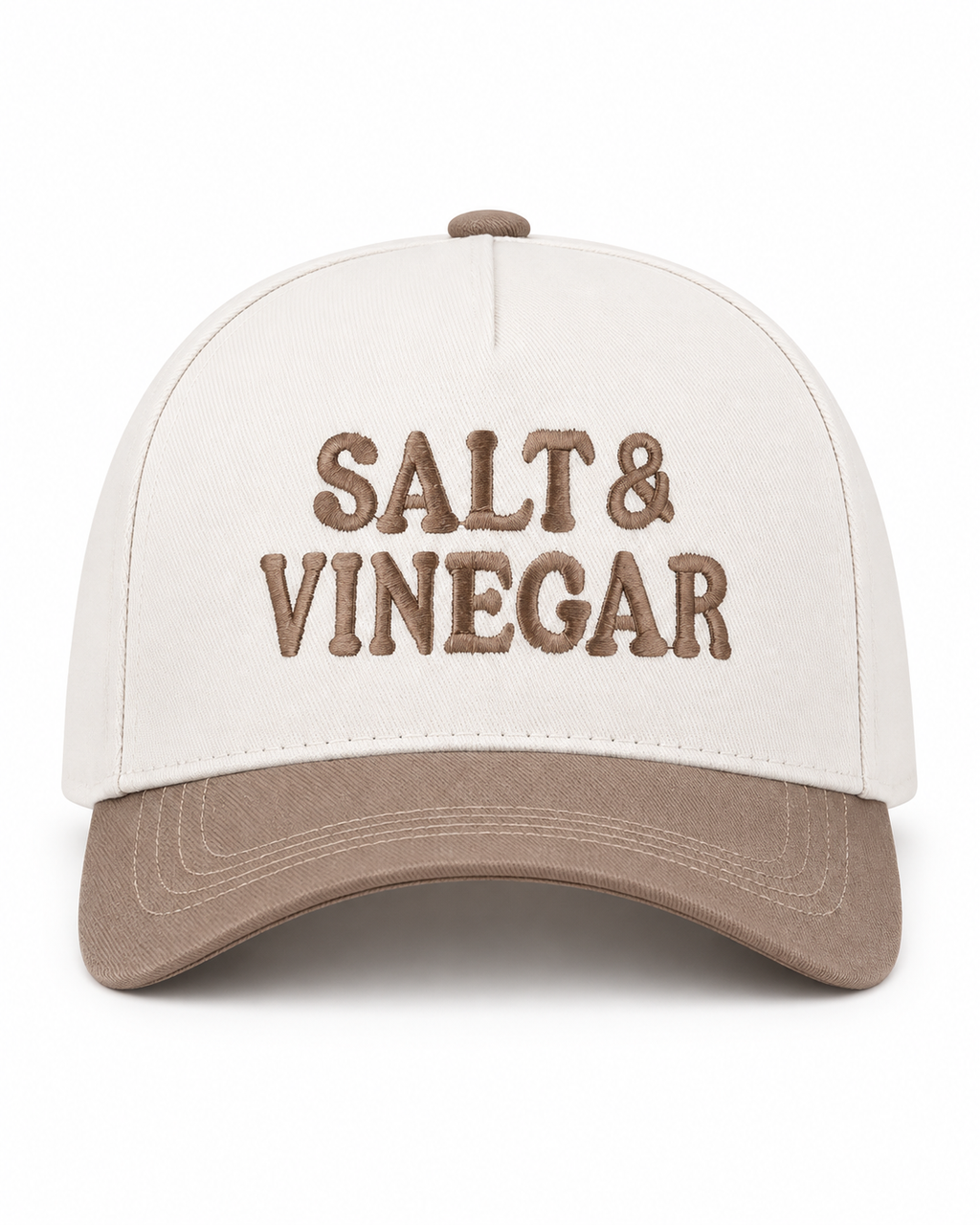 Salt & Vinegar Two-Tone Baseball Cap in Ash Mocha front view showing cream structured cotton crown with bold black embroidered Salt & Vinegar block lettering, mocha taupe bill, and mocha top button on white background
