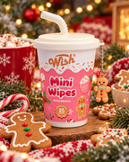Gingerbread mini wipes in a pink cup with a white lid and gingerbread charm, displayed with cookies, candy canes, and Christmas decorations
