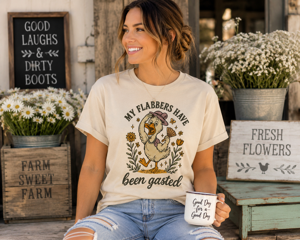 Woman wearing My Flabbers Have Been Gasted graphic tee in a rustic farmhouse setting