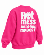 Angled back view of the hot pink Hot Mess sweatshirt showing its white graphic, long sleeves, and ribbed cuffs and hem
