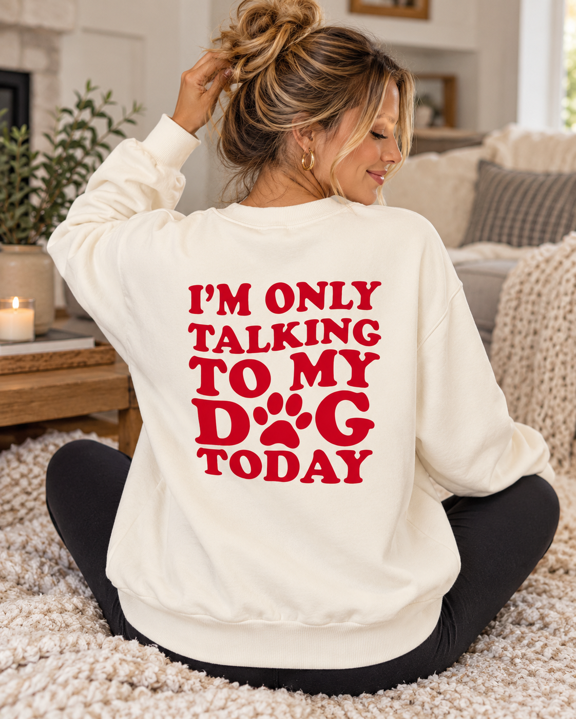 Model showing the red I'm Only Talking to My Dog Today back graphic on a cream sweatshirt, paired with black pants
