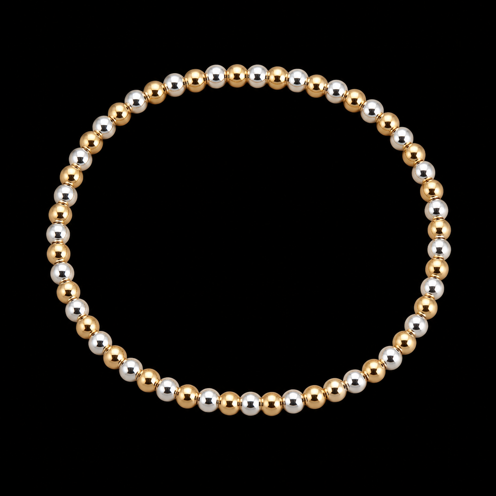 Gold and silver polished round bead stretch bracelet displayed flat in a circle on black background
