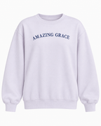 Front view of the light lavender Amazing Grace sweatshirt with navy chest lettering and ribbed cuffs and hem
