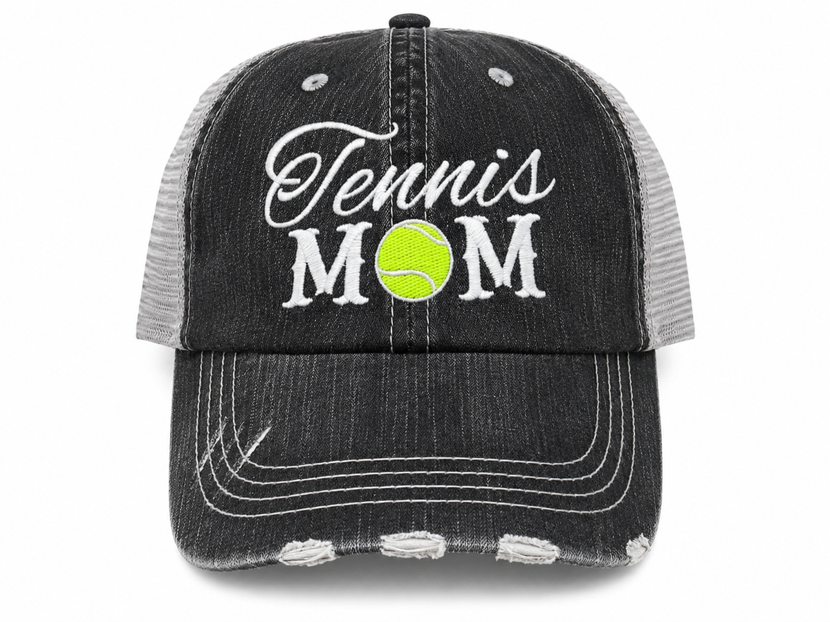 Tennis Mom Trucker Hat with white embroidered script and yellow tennis ball detail on a distressed charcoal front with light gray mesh back
