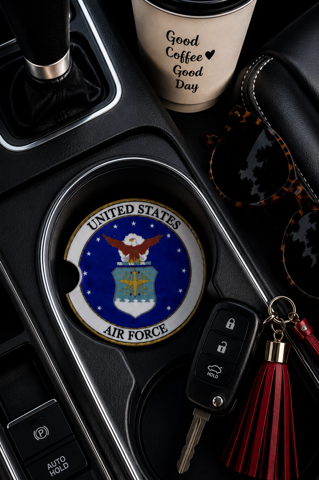 United States Air Force ceramic car coaster in cup holder — official USAF eagle and shield seal on navy blue, shown in car console with coffee cup and sunglasses
