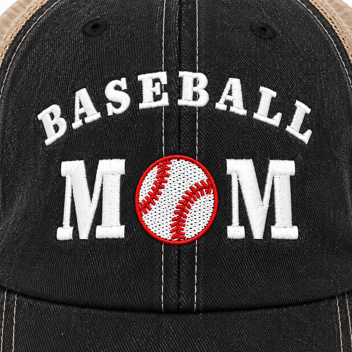 Close-up of embroidered Baseball Mom text on a washed black trucker hat, with a red-outlined baseball patch replacing the letter O in MOM.