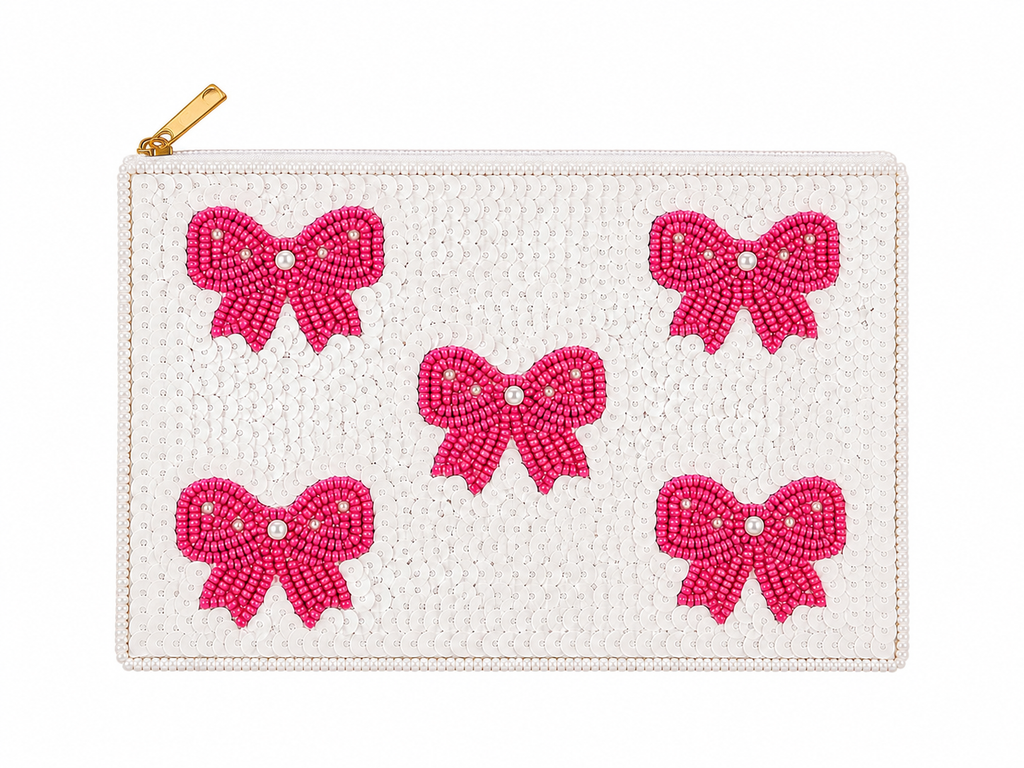 A white beaded clutch bag with five pink beaded bow motifs on the front, featuring a gold zipper pull and a white beaded border.