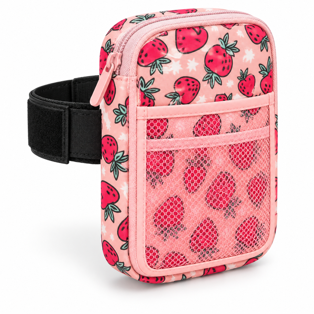Strawberry Tumbler Pouch three-quarter angle view showing light pink all-over strawberry and star print, pink top zipper with pink pull, front mesh pocket, and black elastic tumbler attachment strap on white background

