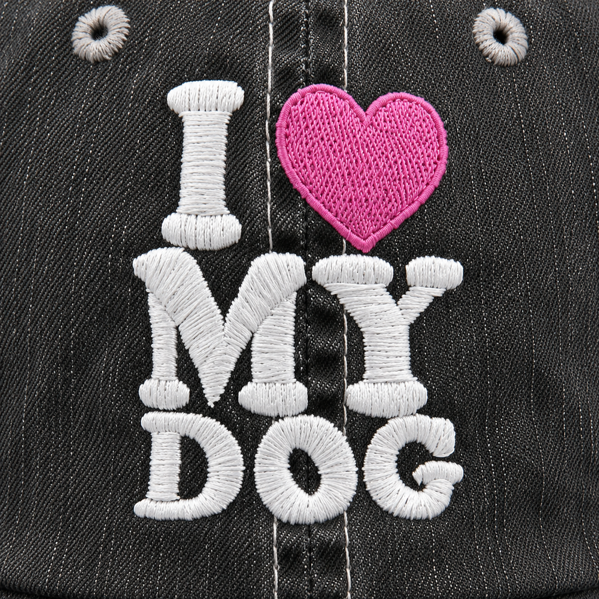 Close-up of I Love My Dog white embroidery with pink heart accent on distressed charcoal trucker hat
