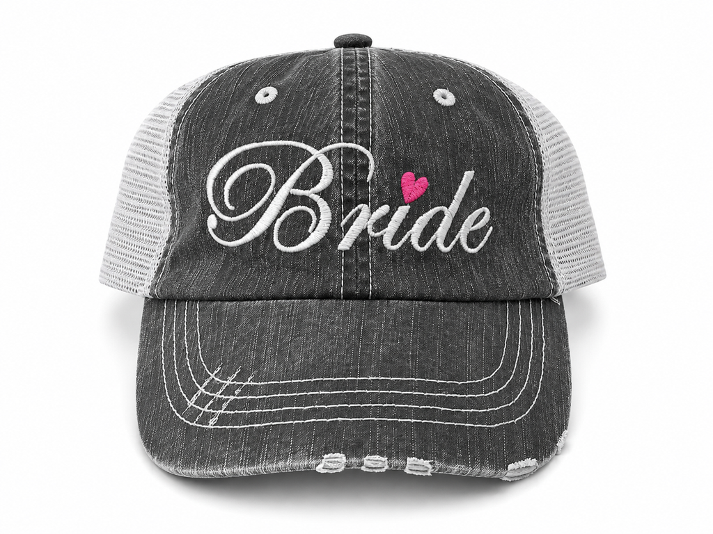 Bride distressed charcoal trucker hat with white script embroidery and pink heart detail, front view
