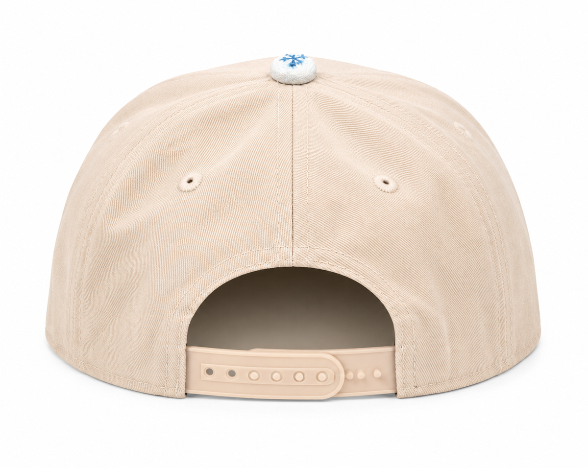 Back view of Revelation Baseball Cap showing sand solid back panels and adjustable snapback closure, on a white background.
