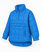 Angled front view of blue quilted puffer pullover jacket showing quilted texture, side pocket opening, and snap cuffs
