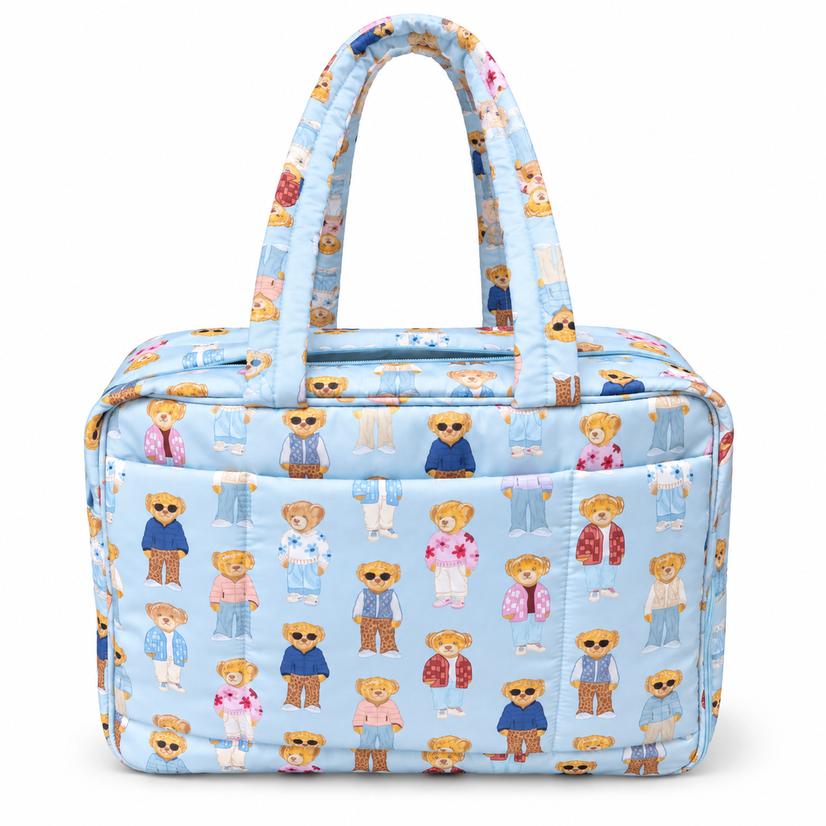 Blue Teddy Bear Weekender Bag front view showing light blue quilted nylon with allover teddy bear print featuring bears in colorful outfits, light blue top zipper, open front slip pocket, and dual padded print handles on white background
