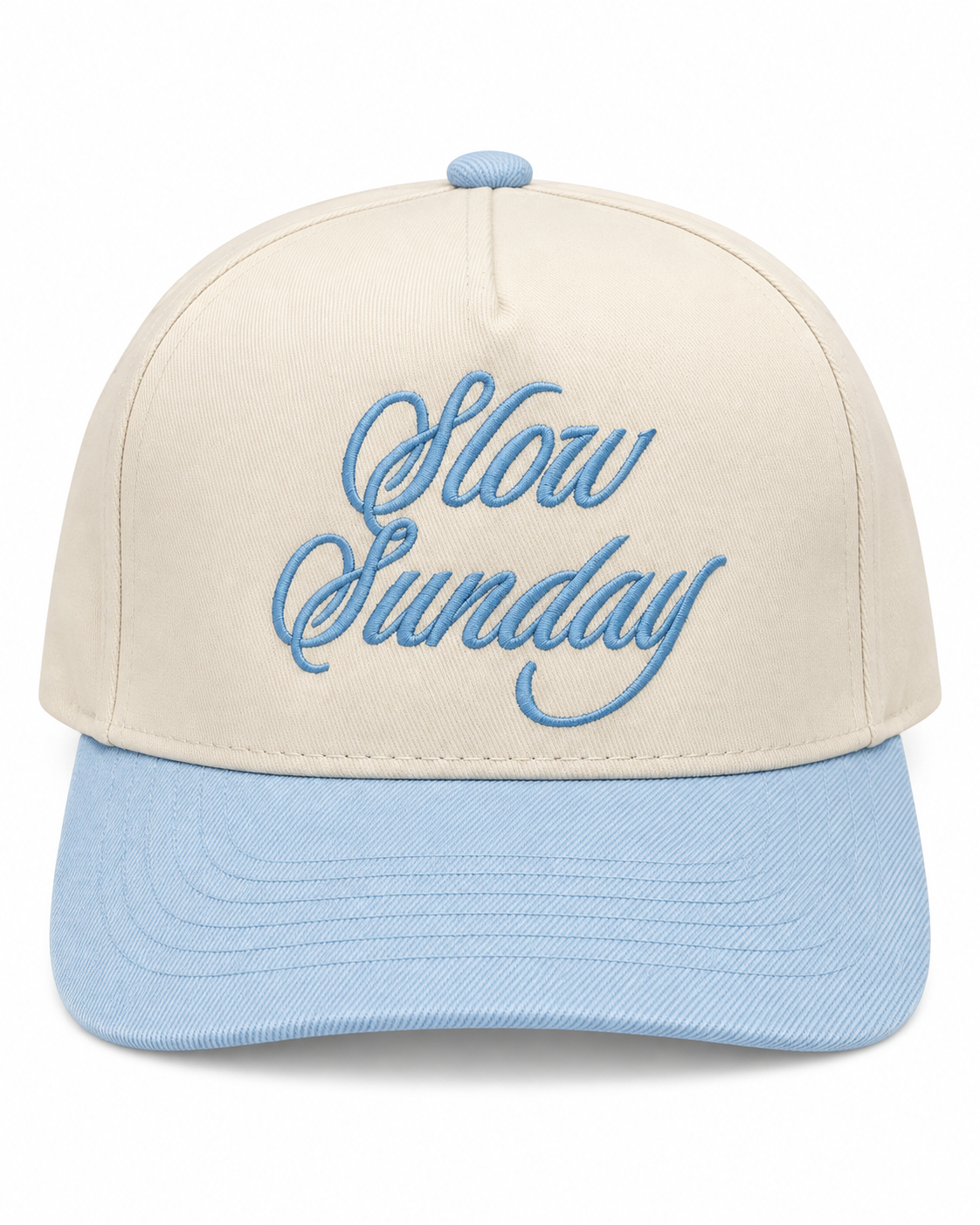 Slow Sunday Baseball Cap front view with cream structured crown, light blue bill and button, and light blue embroidered Slow Sunday script on white background
